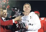  ?? Jae C. Hong / Associated Press ?? Ohio State coach Urban Meyer, right, holds the trophy after the team’s 28-23 win over Washington in the 2019 Rose Bowl in Pasadena, Calif. Meyer agreed to become head coach of the Jacksonvil­le Jaguars on Thursday.