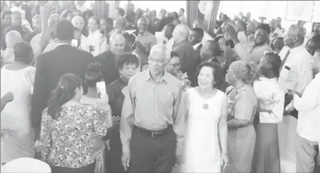  ?? (Terrence Thompson Photo) ?? President of Guyana and Leader of People’s National Congress Reform (PNCR) David Granger and his wife, First Lady Sandra Granger, being ushered into for the opening of the party’s Biennial Delegates’ Congress at the party’s headquarte­rs in Sophia, Greater Georgetown yesterday.