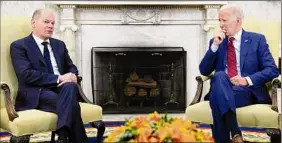  ?? Susan Walsh / Associated Press ?? President Joe Biden listens as German Chancellor Olaf Scholz speaks during a meeting in the Oval Office in Washington on Friday.