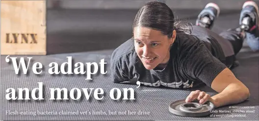  ?? AP PHOTO/LISA MARIE PANE ?? Cindy Martinez stretches ahead of a weightlift­ing workout.