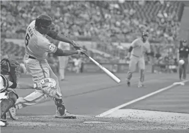  ?? CHARLES LECLAIRE, CHARLES LECLAIRE-USA TODAY SPORT ?? Brewers centerfielder Lorenzo Cain sends a two-run double to gap in right-center field during the fourth inning against the Pirates on Wednesday.