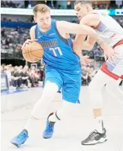  ?? GRAHAM/AGENCE FRANCE-PRESSE ?? LUKA Doncic posts his 50th triple double to lift the Dallas Mavericks to a 127-99 win over the Denver Nuggets. The Slovenian star shot 33 points, grabbed 12 rebounds and had 11 assists.