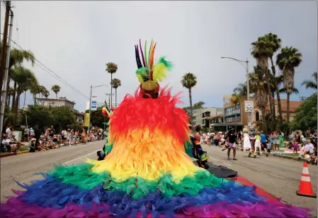  ?? PHOTO BY HOWARD FRESHMAN ?? Shirley Raines, one of the grand marshals, is shown from behind as she rides in the Long Beach Pride Parade along Ocean Boulevard on Sunday.