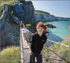  ?? Rick Steves’ Europe/ARIZONA BONUCCELLI ?? Get your ticket to cross Northern Ireland’s ramshackle Carrick-a-Rede Rope Bridge first thing in the morning, before the cruise groups — and the wind — take over.