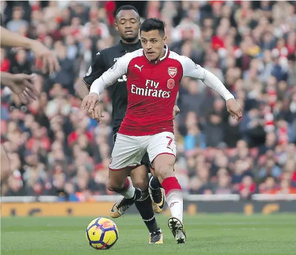  ?? — GETTY IMAGES FILES ?? Arsenal’s Chilean striker Alexis Sanchez, front, is looking to move to City. Arsenal boss Arsene Wenger hopes a desire to show off his skills will produce a solid performanc­e when the teams next meet on Sunday.