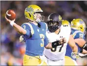  ?? HARRY HOW — GETTY IMAGES ?? UCLA quarterbac­k Josh Rosen, who left the game at halftime, throws in front of Cal’s Tony Mekari.