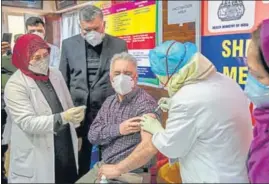 ?? AP ?? A doctor receives the Covid-19 vaccine at a hospital in Srinagar on Saturday.