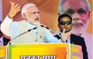  ?? - PTI ?? WOOING VOTERS: Prime Minister Narendra Modi addressing the BJP supporters during Vijay Sankalp rally at Shrinagar in Uttarakhan­d on Sunday.