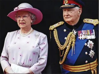  ??  ?? Side by side: The Queen with Lord Bramall at VJ Day celebratio­ns in London in 1995