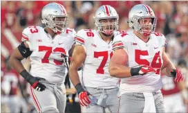  ?? DAVID JABLONSKI / DAYTON DAILY NEWS ?? Ohio State linemen (left to right) Michael Jordan, Brandon Bowen and Billy Price clear the way for the nation’s 13th-best rushing attack.