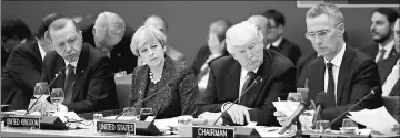  ??  ?? (From left) Turkish President Recep Tayyip Erdogan, British Prime Minister Theresa May, Trump and Stoltenber­g attend a working dinner meeting at the Nato headquarte­rs during a Nato summit of heads of state and government in Brussels, Belgium.