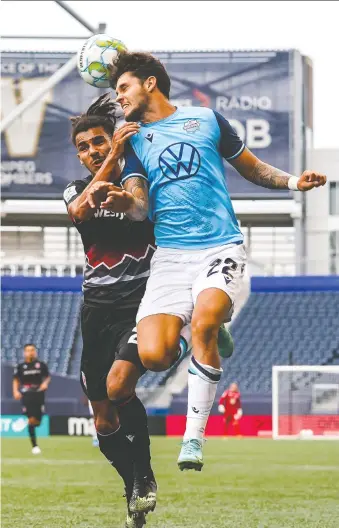  ?? ROBERT REYES ONG/CPL ?? Cavalry FC'S Mohamed Farsi, left, and HFX Wanderers FC'S João Morelli battle for the ball Saturday in Canadian Premier League action in Winnipeg.