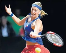  ??  ?? Czech Republic’s Petra Kvitova returns the ball to Germany’s Julia Goerges.