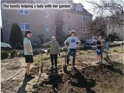  ?? ?? The family helping a lady with her garden