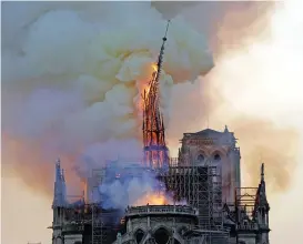  ?? (AFP) ?? This file photo shows the steeple and spire of the Notre-Dame Cathedral collapsing as the cathedral is engulfed in flames in central Paris on April 15