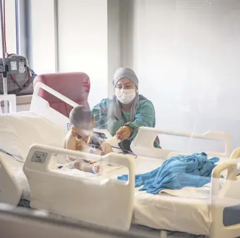  ??  ?? A nurse stands beside the bed of a child patient at the hospital, in Istanbul, Turkey, April 16, 2021.