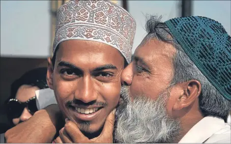  ?? Picture: AP. ?? A Pakistani boy evacuated from Yemen is kissed by his father upon his arrival at the port of Karachi in Pakistan.