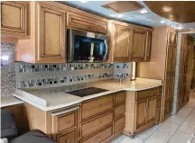  ?? ?? The galley of a Ventana model coach made by Newmar, whose parent company is Winnebago.