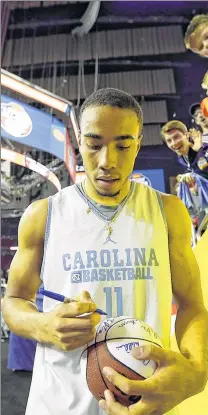  ?? ASSOCIATED PRESS ?? North Carolina's Brice Johnson signs autographs during a practice session Friday at NRG Stadium in Houston.