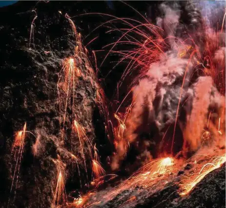  ??  ?? This photo, titled Sparkeling Bombs, was taken at Batu Rara, a volcano on Indonesia’s Komba Island. It was shortliste­d for National Geographic’s Nature Photograph­er of the Year 2016 contest in the action category — Photos: Florent Mamelle