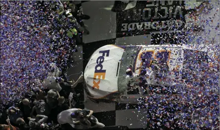  ?? CHRIS O’MEARA ?? Denny Hamlin is showered with confetti in Victory Lane after winning a NASCAR Daytona 500 auto race on Sunday, at Daytona Internatio­nal Speedway in Daytona Beach, Fla. AP PHOTO/ Multiple cars, including Austin Dillon (3), Daniel Suarez (41), David Ragan (38), Paul Menard (21), Ryan Newman (6), Aric Almirola (10), Matt DiBenedett­o (95), and Ryan Blaney (12) crash during a NASCAR Daytona 500 auto race on Sunday, at Daytona Internatio­nal Speedway in Daytona Beach, Fla. AP PHOTO/CHRIS O’MEARA)