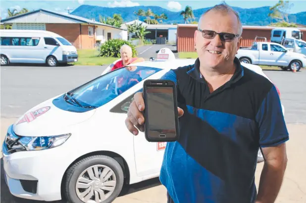  ?? Picture: JUSTIN BRIERTY ?? REALLY APPY: Father and son duo Ray and John McRoberts have created a ride share app to take on Uber, starting at Port Douglas.