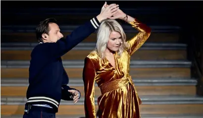  ??  ?? Olympique Lyonnais’ Ada Hegerberg (right) dances with French DJ and producer Martin Solveig after receiving the 2018 Fifa Women’s Ballon d’Or award. Solveig, who had asked Hegerberg whether she could “twerk” live on stage, later apologised. —