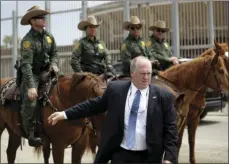  ??  ?? In this May 7 picture, Thomas Homan, the recently retired acting director of U.S. Immigratio­n and Customs Enforcemen­t, greets border patrol agents along the border with Tijuana, Mexico, in San Diego. AP PHOTO/GREGORY BULL