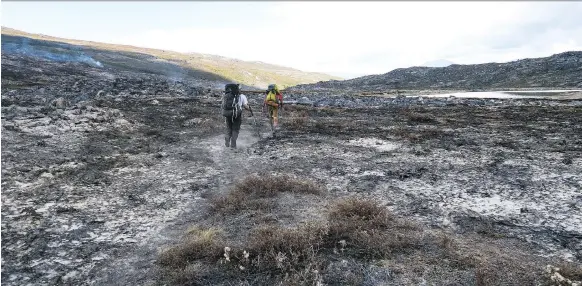  ?? PHOTOS: DINA MISHEV/FOR THE WASHINGTON POST ?? The aftermath of last summer’s wildfires along the Arctic Circle Trail looked like an epic battle had been waged on the country’s land.