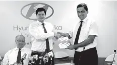  ??  ?? Hyundai Lanka (Pvt.) Ltd Director Julian Reuter exchanging the MOU with SOS Children’s Villages Sri Lanka Senior Project Director Programmes Keerthi Hettiarach­chi