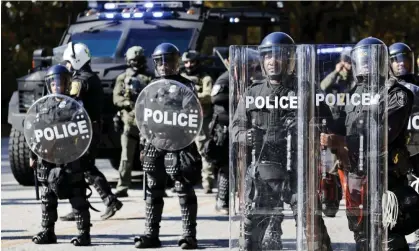  ?? Photograph: Erik S Lesser/EPA ?? Atlanta police officers in riot gear gather in response to demonstrat­ors protesting against Cop City, in this picture from November.