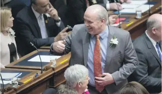  ??  ?? Premier John Horgan gives the thumbs up prior to hearing Lt.-Gov. Janet Austin deliver the throne speech in the legislatur­e on Tuesday.