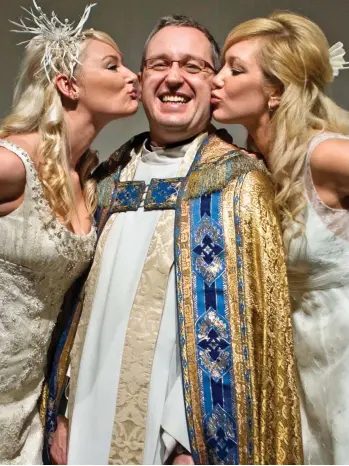  ??  ?? Clerical controvers­y: The call by Kelvin Holdsworth, pictured with models at a wedding exhibition, to pray for a gay Prince George, left, has been criticised