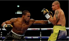  ??  ?? BEAST: Hobbs [right] feels the heft of Yarde’s jab to the body