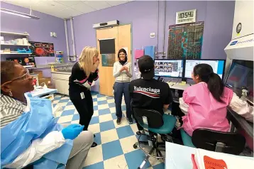  ?? Regeneron via AP ?? ■ Members of the Infectious Disease team celebrate March 13 at their lab in New York state after confirming cells from Singapore are viable and that some make antibodies that bind to the coronaviru­s, suggesting they may have the potential to block it.