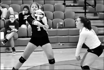  ?? Photo by John Zwez ?? Leah Steinke of Botkins, left, plays the ball, as Ainsley Manger looks on during Saturday’s match at Wapakoneta.