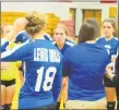  ?? Peter Wallace / For Hearst Connecticu­t Media ?? Lewis Mills star Anna Szymanski, center, led the Spartans to a Class M girls volleyball first round win on Monday night.