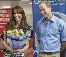  ??  ?? NICE BUNCH: Kate and William at yesterday’s event and, right, the Prince resists the cupcakes in front of him