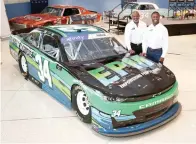  ?? Garry Eller/HHP for Chevy Racing via AP ?? Pro Football Hall of Famer Emmitt Smith, left, and NASCAR driver Jesse Iwuji pose with the No. 34 Chevrolet Camaro SS Iwuji will drive in the upcoming 2022 NASCAR Xfinity Series season at the NASCAR Hall of Fame in Charlotte, N.C. Iwuji will run his first full season in NASCAR with backing from Pro Football Hall of Famer Emmitt Smith and General Motors.