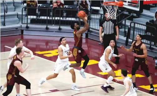  ?? SHAFKAT ANOWAR/AP ?? Loyola guard Keith Clemons prepares to shoot as he glides to the basket Saturday against Southern Illinois at Gentile Arena.