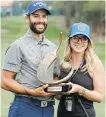  ?? MIKE CARLSON, THE ASSOCIATED PRESS ?? Adam Hadwin and his fiancé Jessica Kippenberg­er were all smiles Sunday in Palm Harbour, Florida, and now they’ll get married in two weeks.