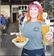  ?? STEVE MacNAULL/The Okanagan Weekend ?? Waitress Megan at Loma Brewing Co. in Los Gatos delivers the Loma Vida beer and jackfruit salad bowl.