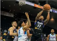  ?? CLIFFORD OTO/THE STOCKTON RECORD ?? The Stockton Kings' Isaiah Canaan, right, goes to the hoop against Oklahoma City Blue's Sedrick Barefield during a GLeague game on March 11, 2020, at Stockton Arena.