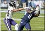 ?? THE ASSOCIATED PRESS ?? Tennessee Titans wide receiver A.J. Brown (11) makes a catch ahead of Ravens cornerback Marlon Humphrey (44) in the first half Sunday.