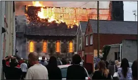  ??  ?? Destroyed: Aberfan’s historic chapel in flames after Brown’s attack