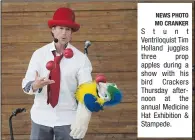  ?? NEWS PHOTO MO CRANKER ?? Stunt Ventriloqu­ist Tim Holland juggles three prop apples during a show with his bird Crackers Thursday afternoon at the annual Medicine Hat Exhibition & Stampede.