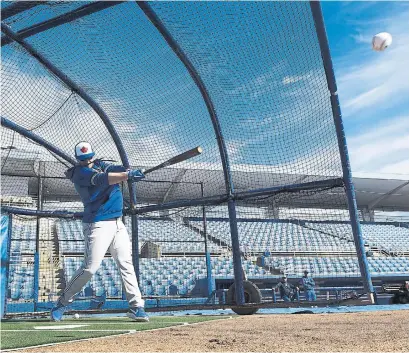  ?? NATHAN DENETTE THE CANADIAN PRESS ?? Toronto Blue Jays catcher Danny Jansen takes part in batting practice during the opening day of spring training in Dunedin, Fla.