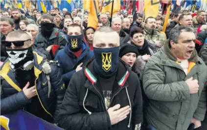  ??  ?? Ukrajinski nacionalis­ti obilježili su treću obljetnicu početka rata u Ukrajini