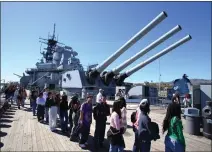  ?? PHOTO BY RAPHAEL RICHARDSON ?? Hundreds of high school students walk past the guns of the USS Iowa for a Black History event on the ship in San Pedro on Feb. 9, 2023.