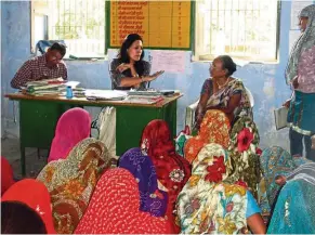  ??  ?? Rajawat (seated, second from left) believes women who know what is best for their families are more likely to speak up with women leaders.